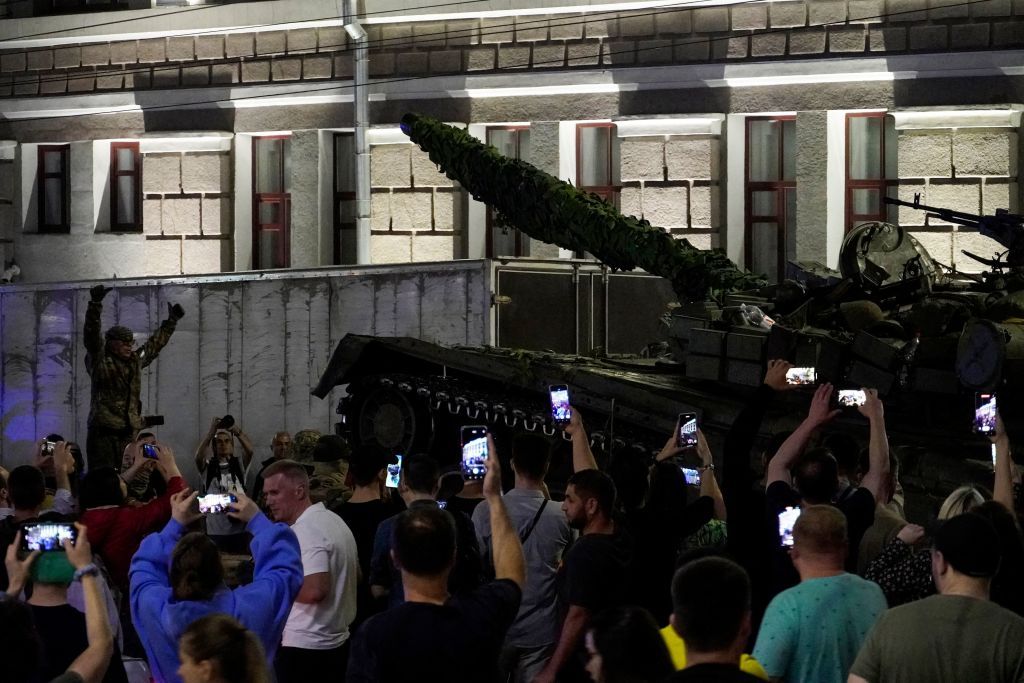 A crowd surrounds a Wagner Group tank in Rostov-on-Don on June 24, 2023. (Photo by STRINGER/AFP via Getty Images)