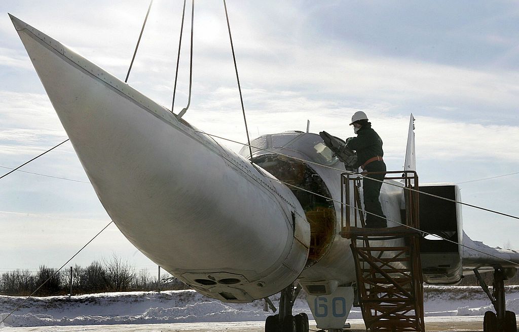 A worker dismantles Ukraine's last Tupolev-22M3 strategic aircraft at a military base in Poltava, Ukraine, on Jan. 27, 2006.