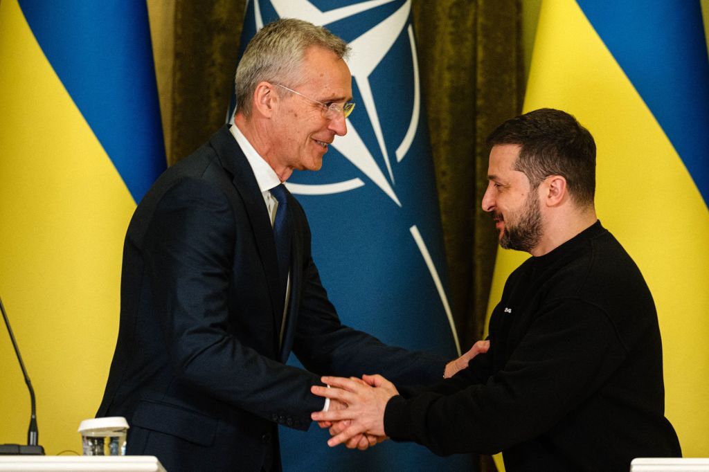 NATO Secretary General Jens Stoltenberg (L) shakes hands with President Volodymyr Zelensky in Kyiv on April 20, 2023