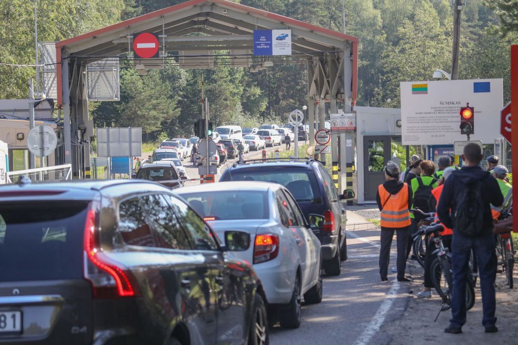 Vehicles and bike riders at a Lithuanian border crossing on Aug. 12, 2023. (Petras Malukas/AFP via Getty Images)