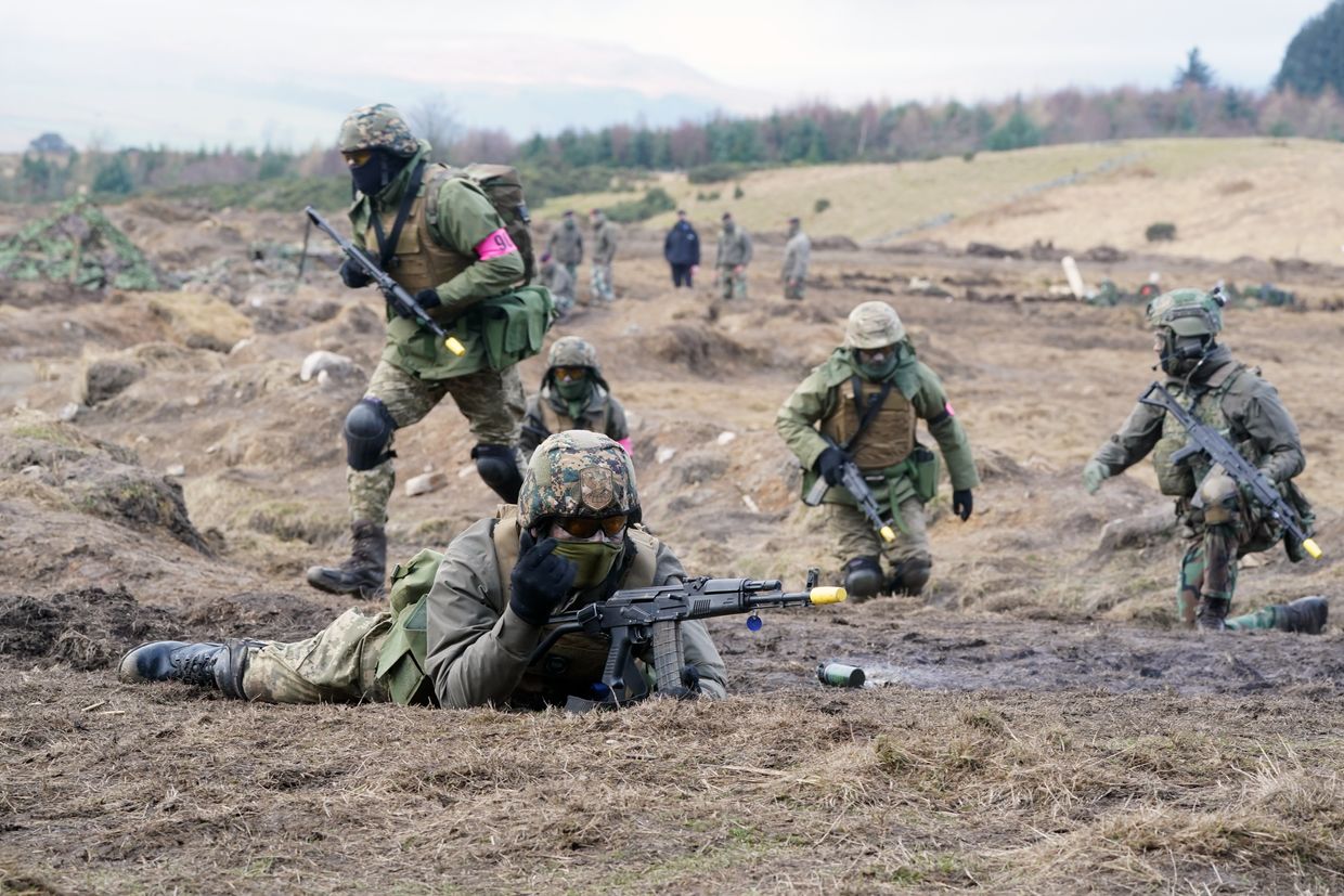 Ukrainian soldiers take part in a military exercise at a military training camp in Yorkshire.