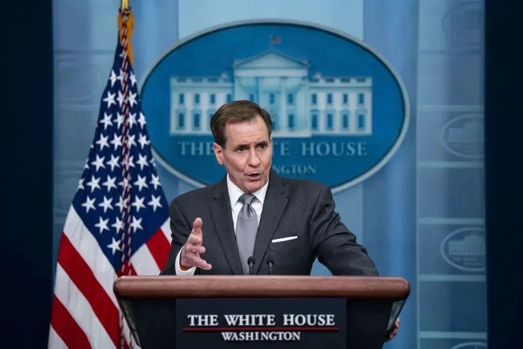 U.S. National Security Council spokesperson John Kirby addresses reporters behind a podium at the White House.