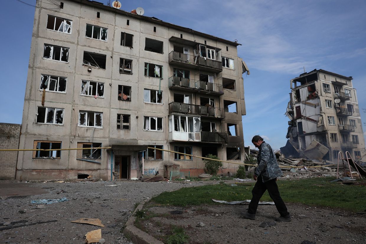  A resident walks past buildings destroyed by an air bomb in Ocheretyne near Avdiivka, Donetsk region, April 15, 2024