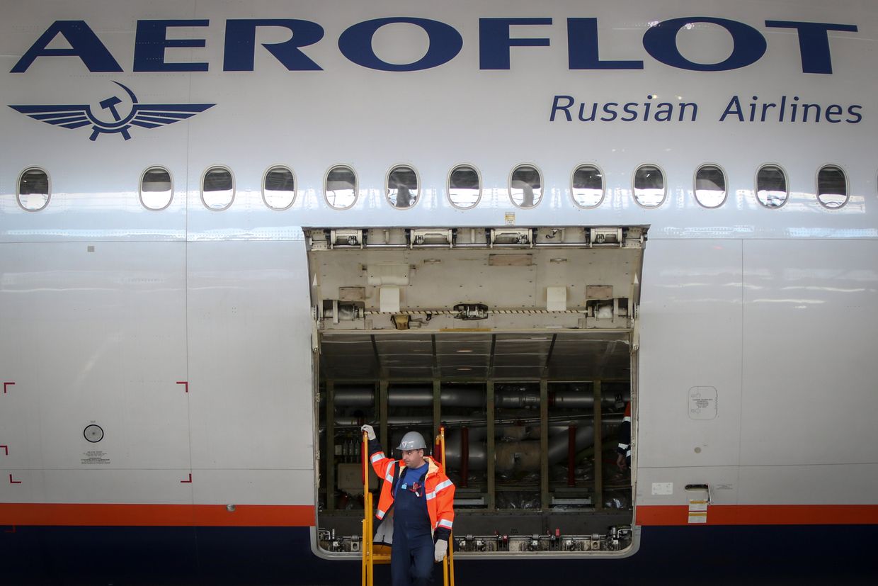 An employee inspects the cargo hold of a Boeing-777 aircraft at Moscow-Sheremetyevo Airport.