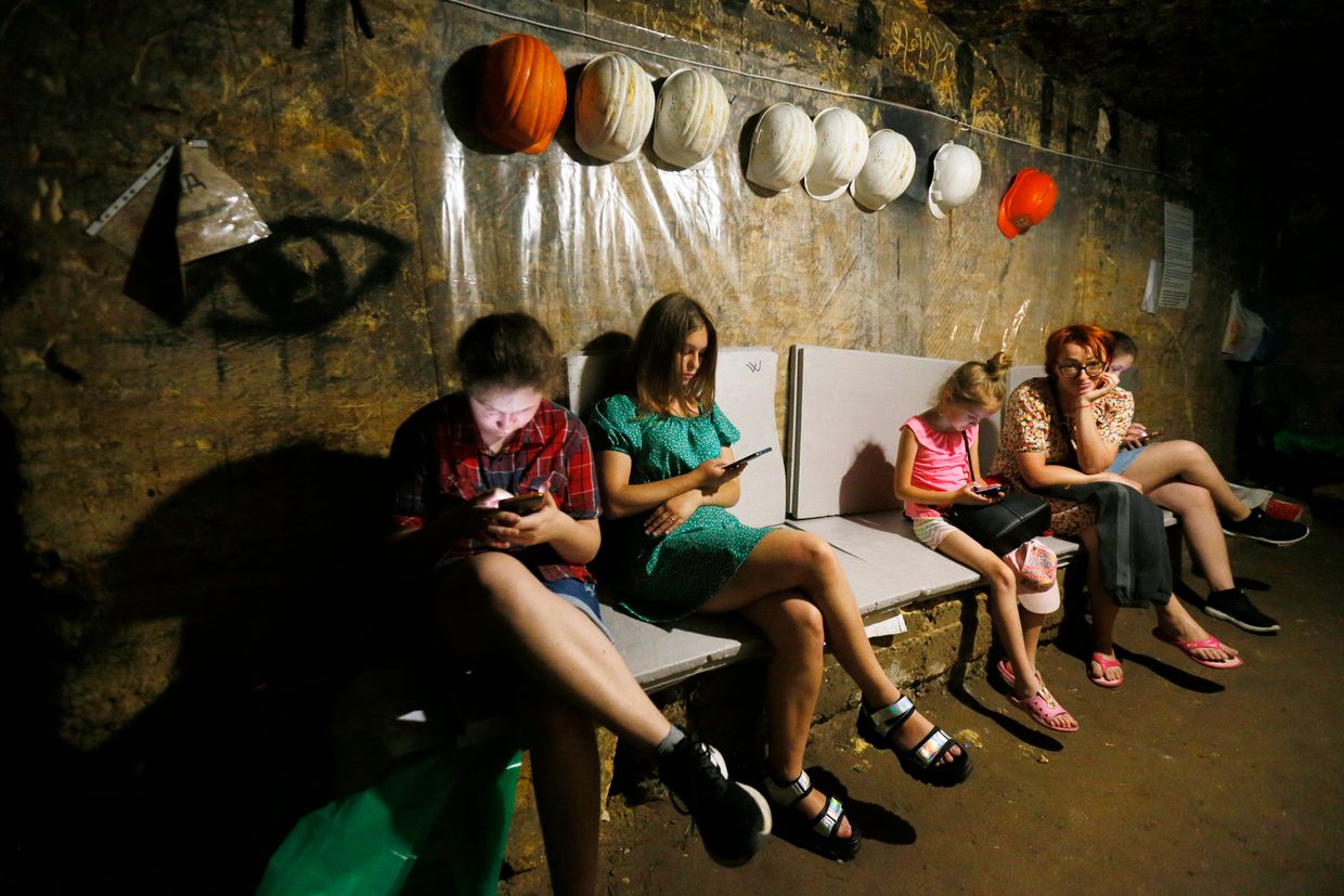 People take shelter in the catacombs using it as a bomb shelter during an air raid alert amid Russia's invasion of Ukraine