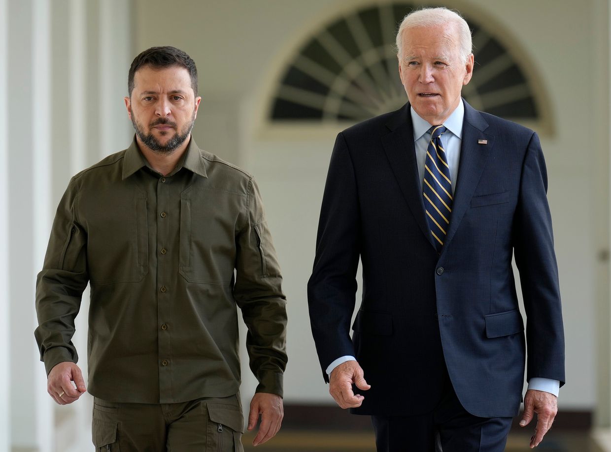 President of Ukraine Volodymyr Zelensky walks with U.S. President Joe Biden down the colonnade to the Oval Office