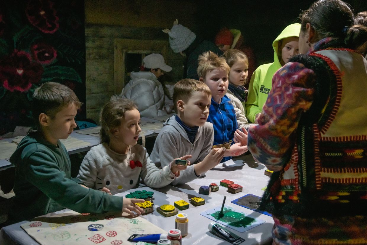 Forcedly displaced children from Melitopol, who lost their homes due to the Russian invasion, attend a bag-making workshop