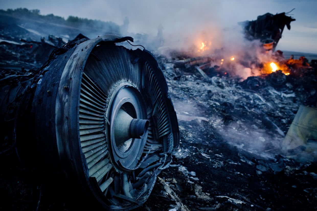 Debris from Malaysia Airlines Flight 17 is shown smoldering in a field in Hrabove, Ukraine