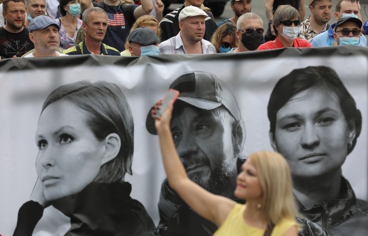 People march through at the Khreshchatyk street during the rally in Kyiv, Ukraine, July 4, 2020