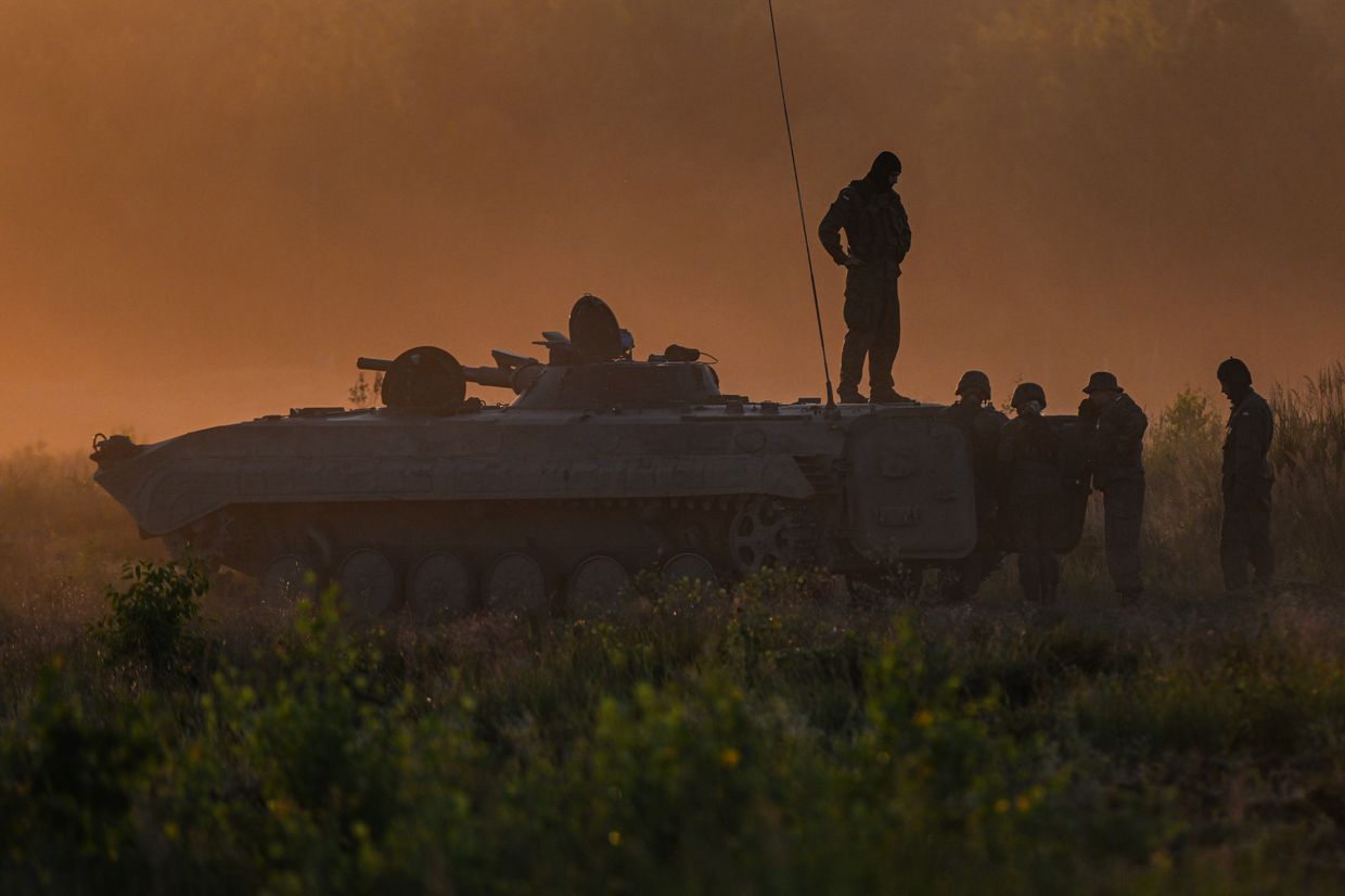 Soldiers take part in a training demonstration with the NATO multinational battle group eFPon at the Orzysz, Poland training ground 