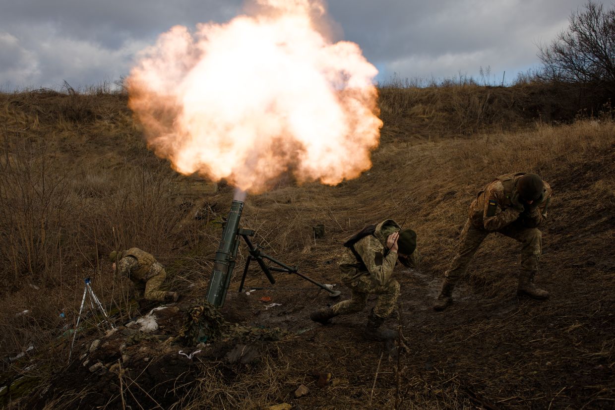 Crew members of the 56th Motorized Brigade fire a mortar at Russian positions near Bakhmut, Donetsk Oblast, Ukraine, on Feb. 2, 2024.