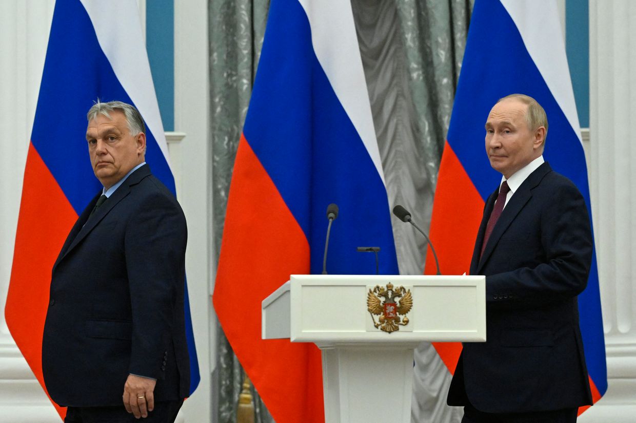 Vladimir Putin and Hungary's Prime Minister Viktor Orban arrive to deliver a joint press statement following their talks at the Kremlin in Moscow, Russia 