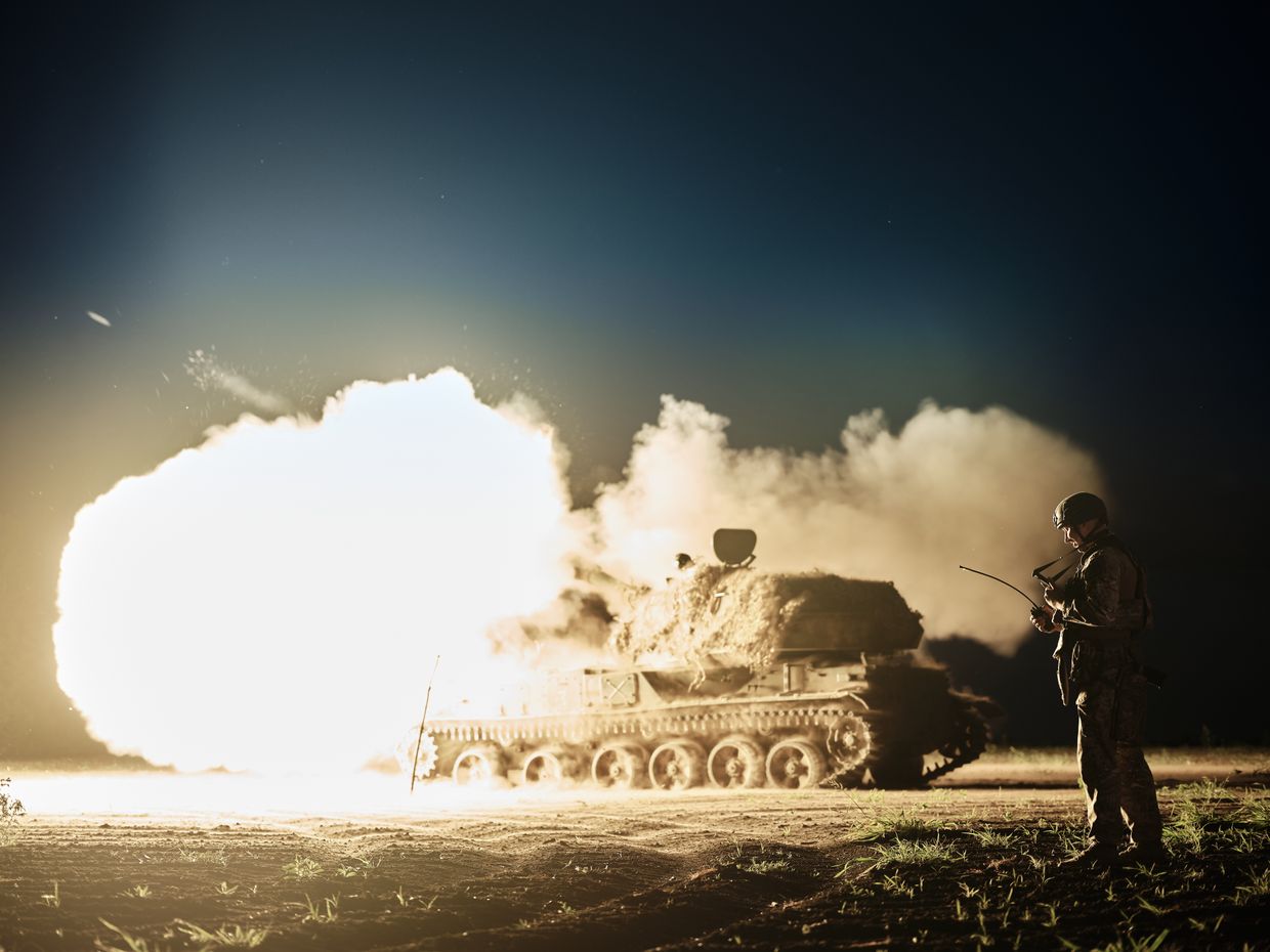 The commander of the artillery division Vlad with the call sign "Kalyna" looks at the combat tablet