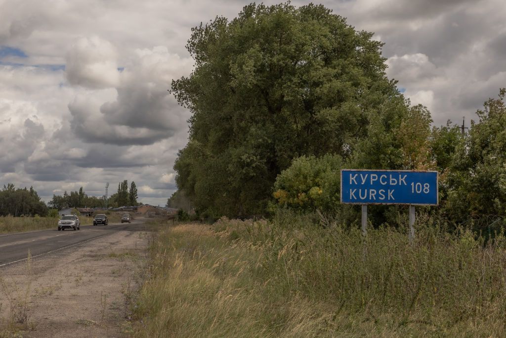 Ukrainian military vehicles driving past the border crossing point into Russia's Kursk Oblast from neighboring Sumy Oblast, Ukraine on Aug. 13, 2024. 