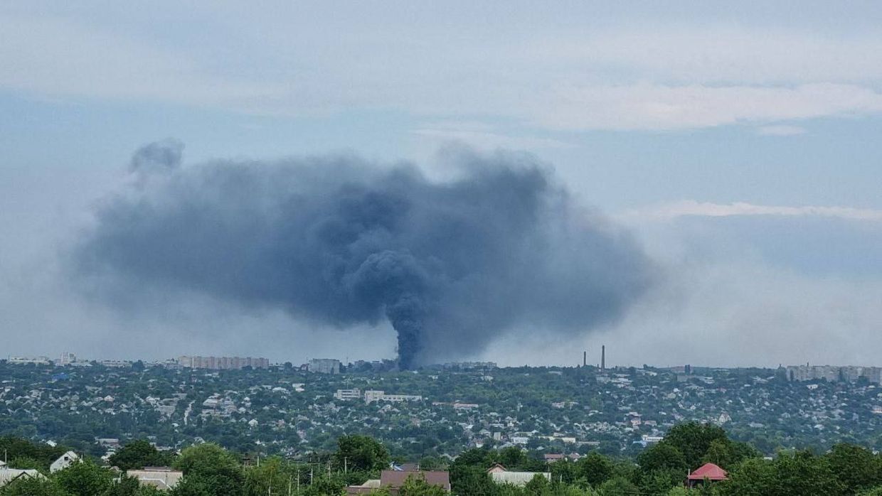 A smoke rising over the Factory 100 machine repair plant in Luhansk.