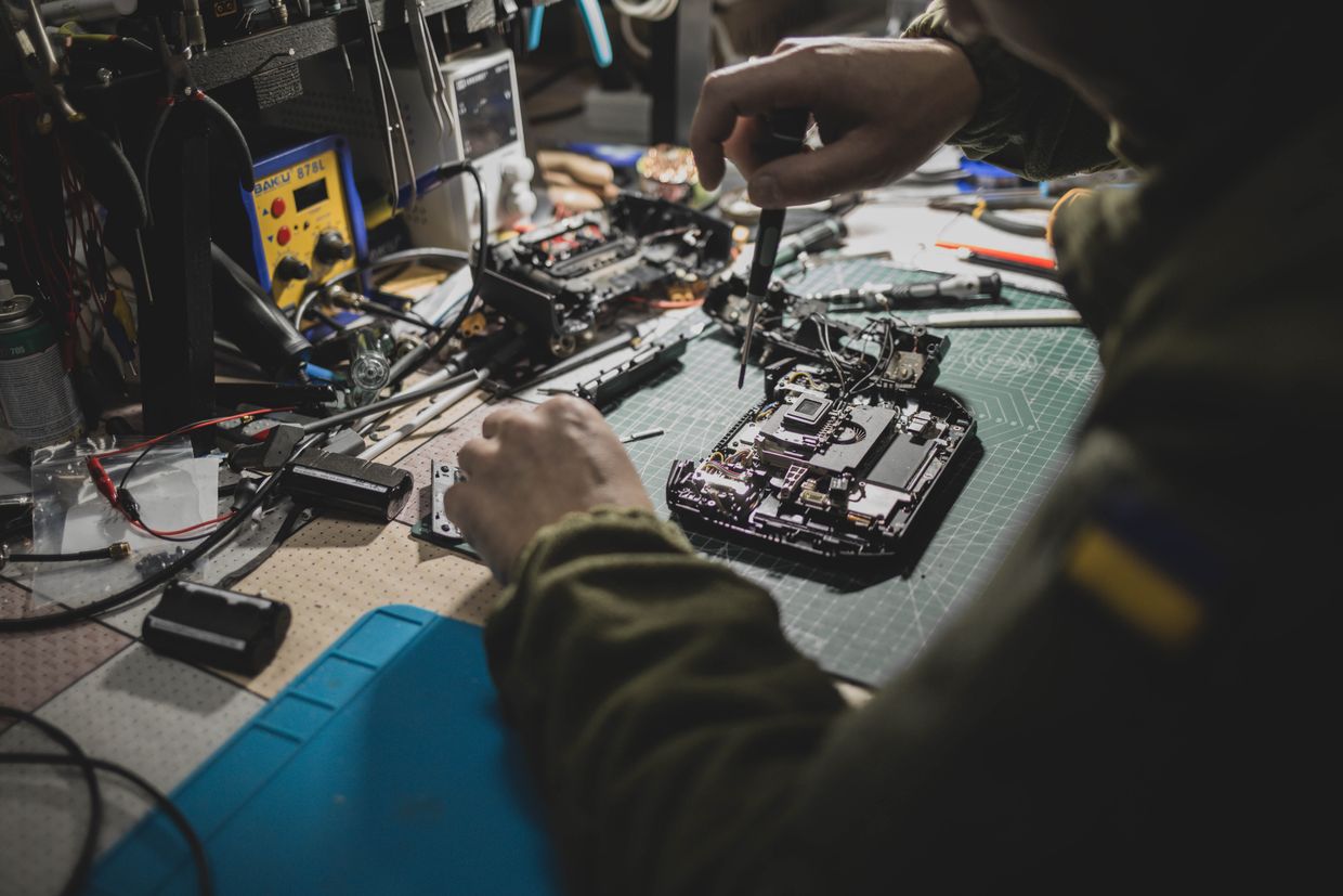 A Ukrainian military repairs a drone control panel in a workshop in Donetsk Oblast, Ukraine on Dec. 19, 2023.