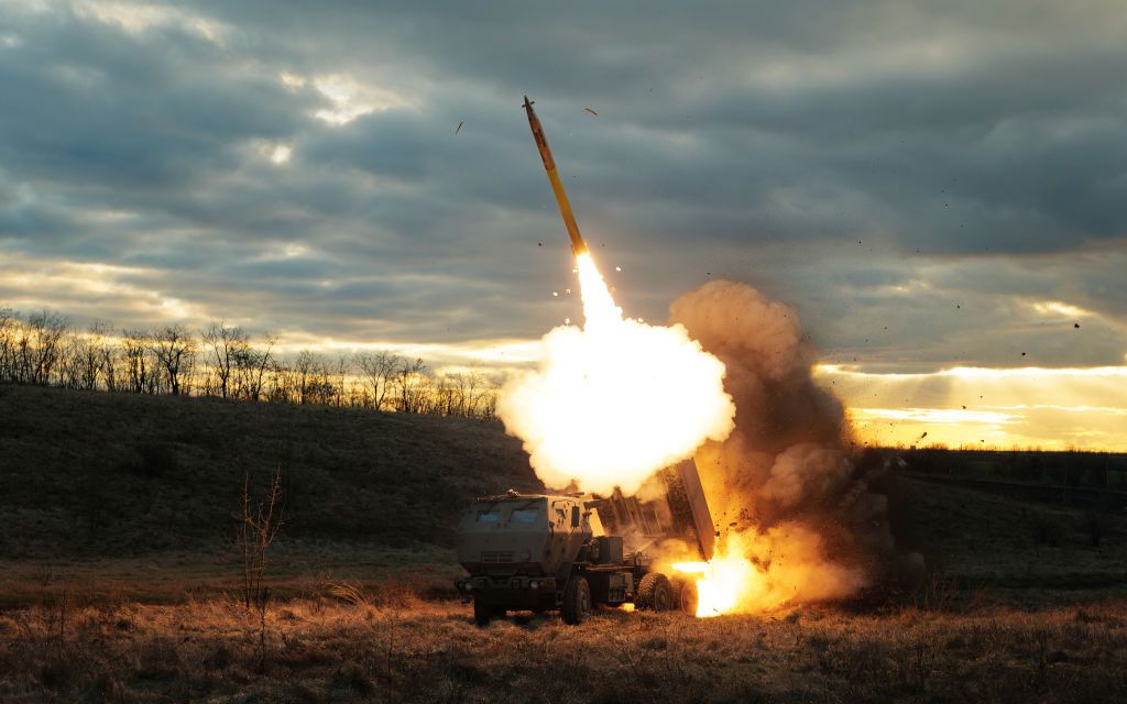 A Ukrainian-operated HIMARS launches a rocket at Russian positions at an unspecified location in Ukraine