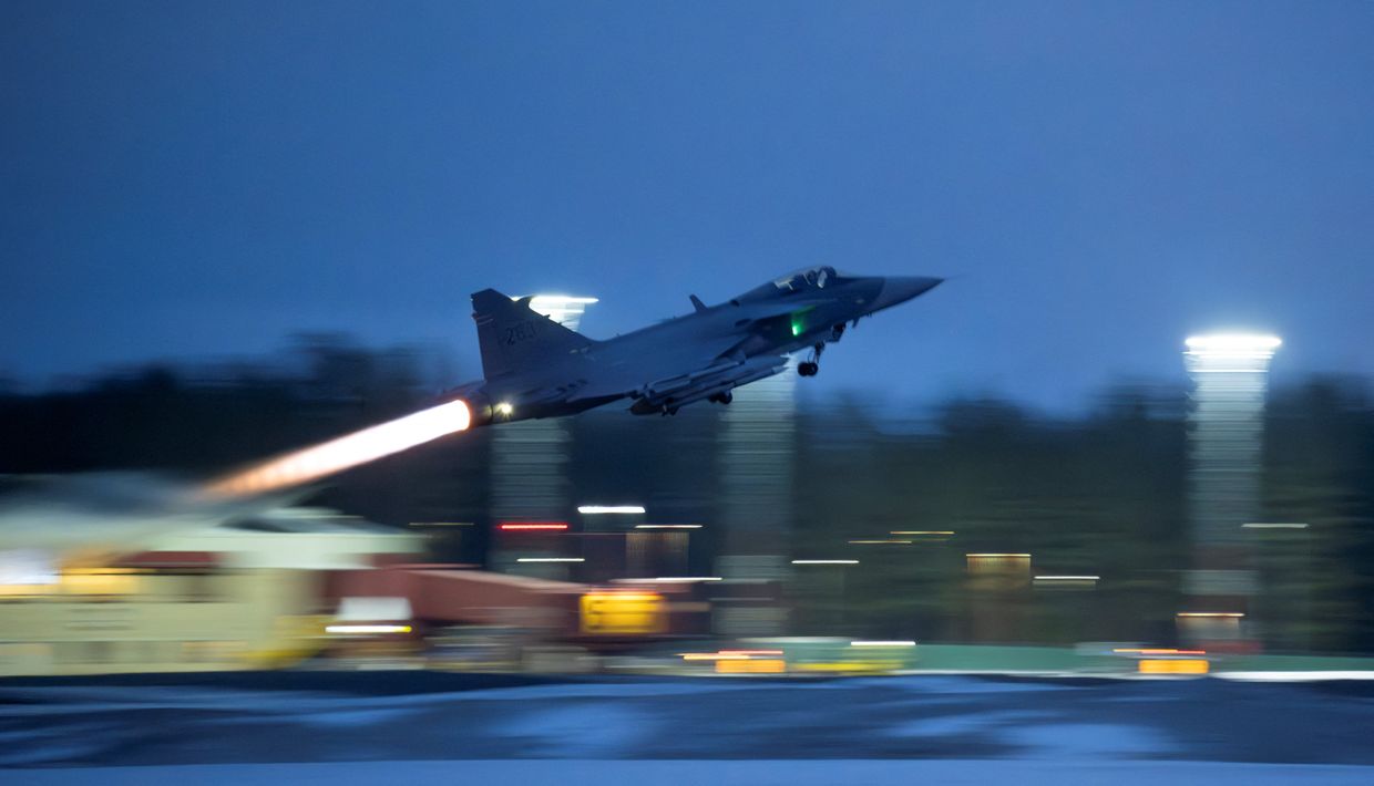 A JAS 39 Gripen C/D fighter aircraft takes off from Lulea-Kallax Airport, Sweden on March 4