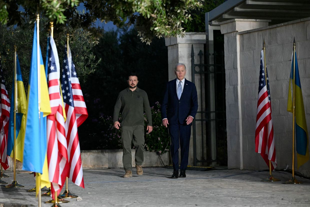 Zelensky (L) and Biden (R) at the G7 Summit hosted by Italy in Apulia region in Savelletri on June 13, 2024. 