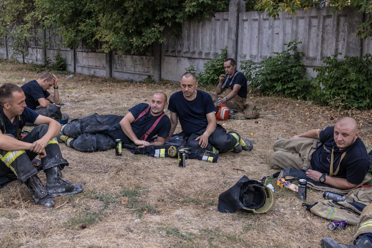 Emergency workers stay away from the strike site and rest during an air raid alert in Poltava, Ukraine on Sep. 3, 2024. 