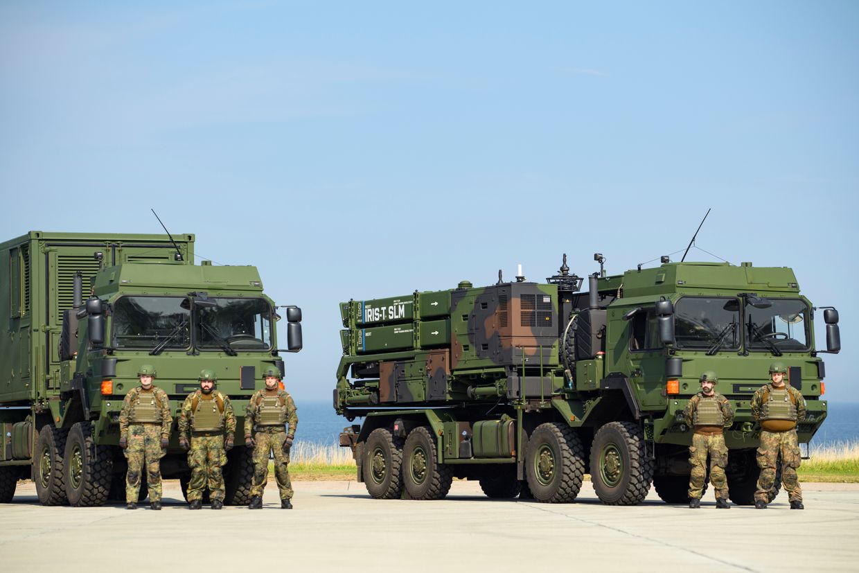 Soldiers standing guard in front of a IRIS-T SLM air defence system prior to the arrival of German Chancellor Olaf Scholz 