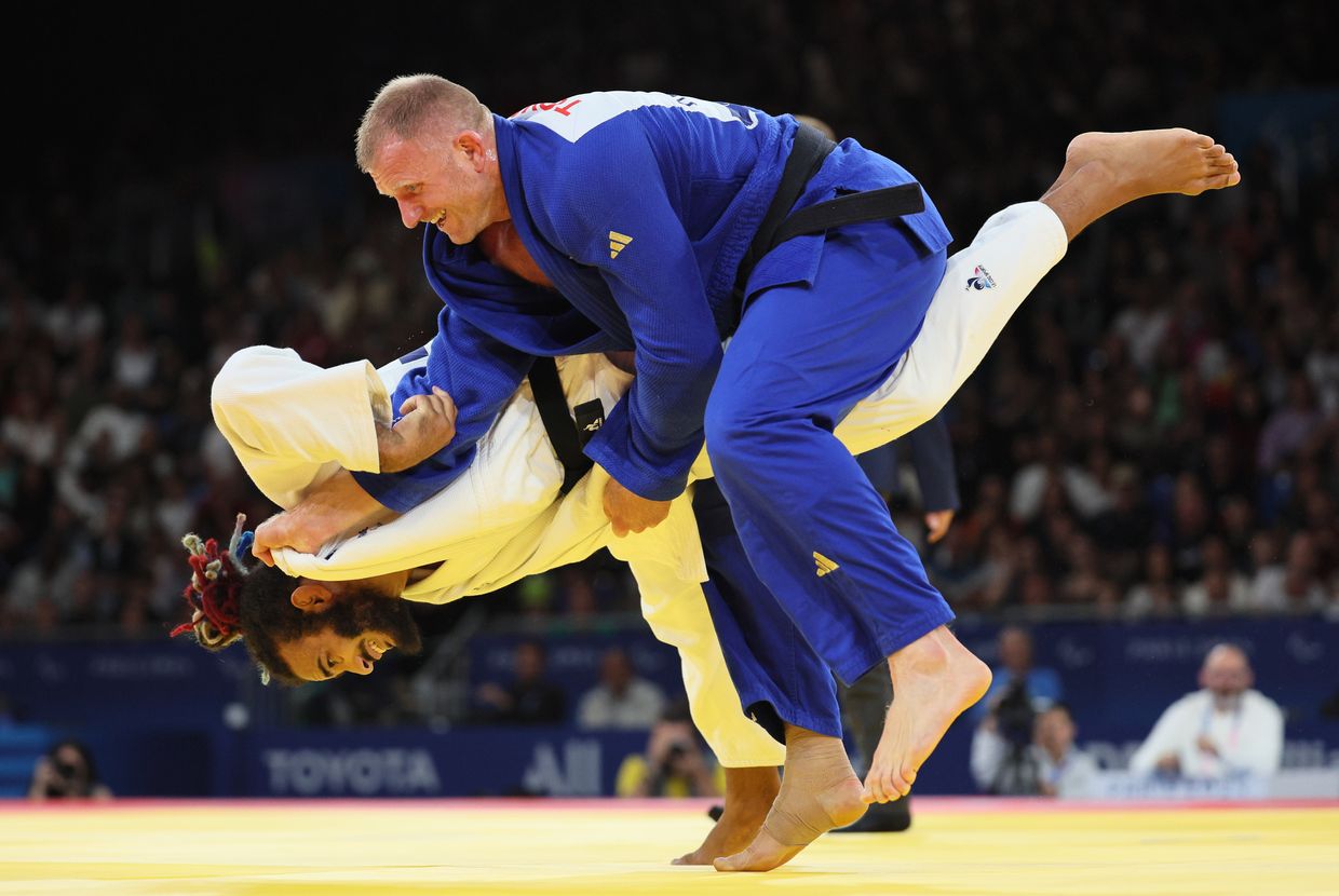 Hélios Latchoumanaya of Team France attempts to throw Oleksandr Nazarenko of Team Ukraine during the Men's Para Judo 90kg-J2 Gold Medal Match 