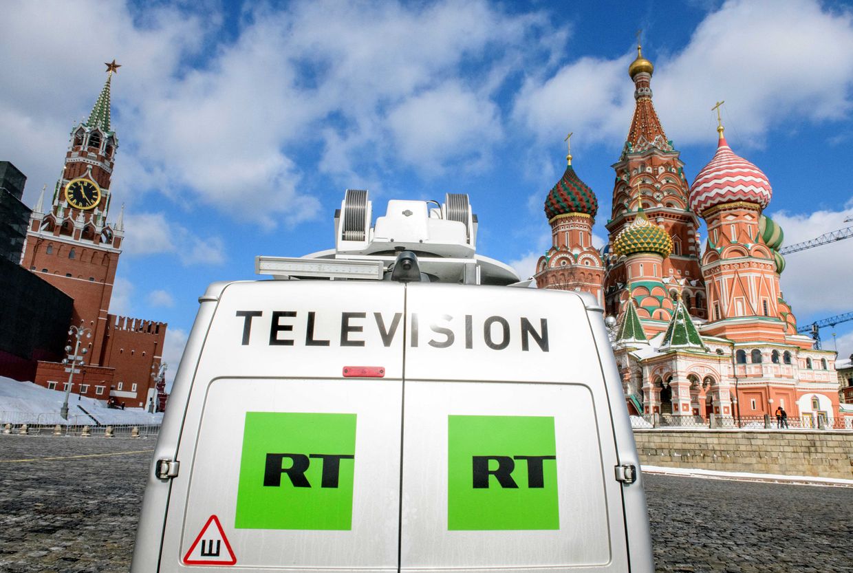 A Russia's state-controlled Russia Today's (RT) television broadcast van is seen parked in front of St. Basil's Cathedral and the Kremlin next to Red Square 