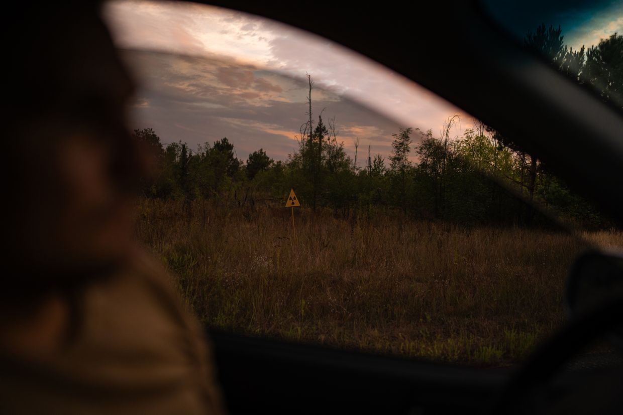 A sign “Caution, radiation” in Chornobyl zone, Kyiv Oblast