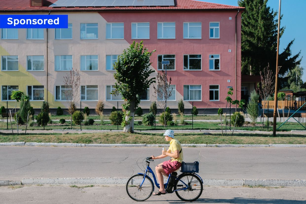 A person riding on a bicycle in Kulykivka, Chernihiv Oblast, Ukraine