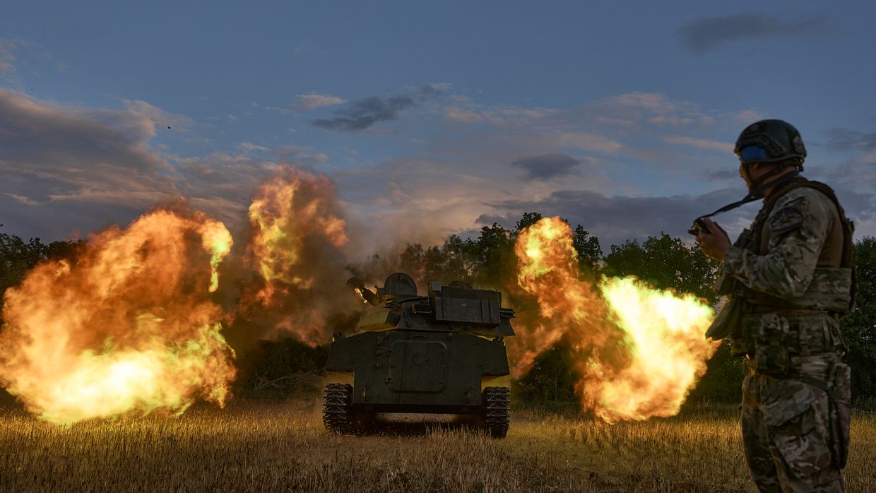 Soldiers fire a 2C1 "Carnation" - Soviet 122-mm regimental self-propelled artillery installation