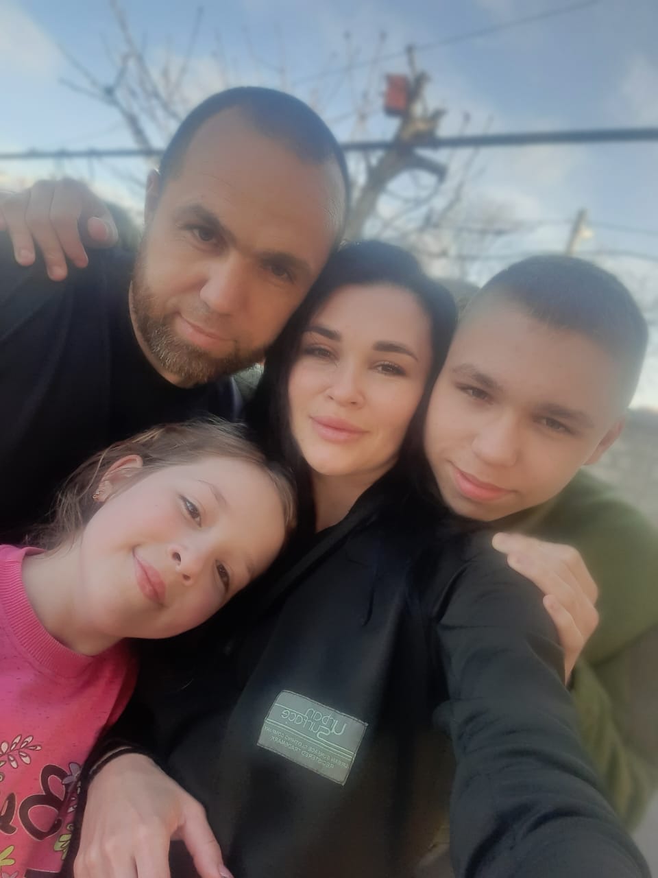 Oksana and Serhiy with their two children: 16-year-old Marat and 11-year-old Elina. 