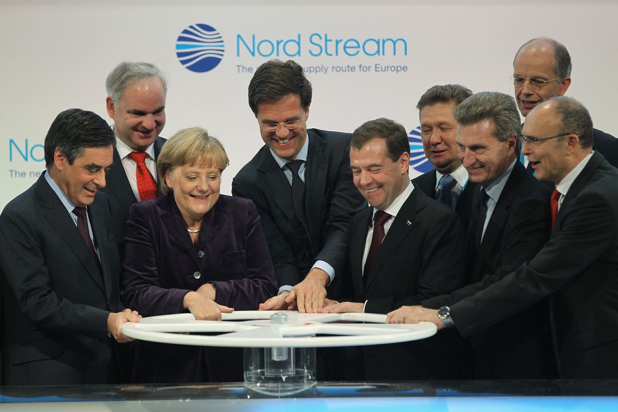 French Prime Minister Francois Fillon, German Chancellor Angela Merkel, Dutch Prime Minister Mark Rutte, Russian President Dmitry Medvedev, and European Union Energy Commissioner Guenther Oettinger turn a wheel to symbolically start the flow of gas through the Nord Stream Baltic Sea gas pipeline