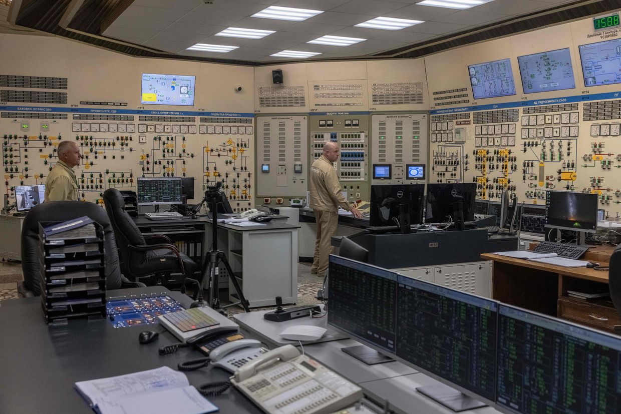 Employees work in the control room of the South Ukraine Nuclear Power Plant near the city of Pivdennoukrainsk