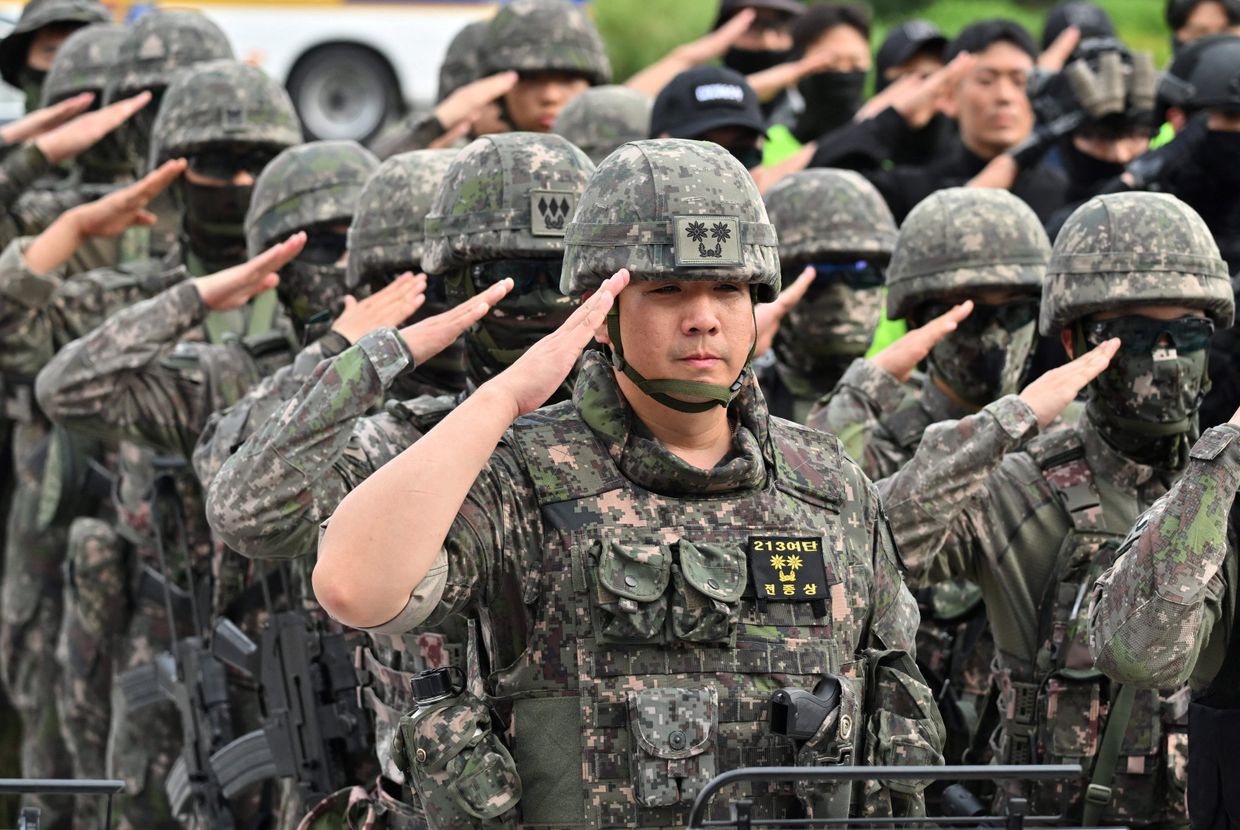 South Korean soldiers salute after an anti-terror drill during the Ulchi Freedom Shield exercise at the National Assembly in Seoul on Aug. 22, 2023.