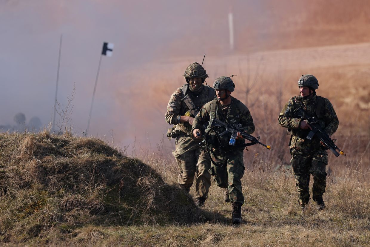 UK's 2nd Battalion Royal Anglian infantry unit storms an enemy position in a simulated attack during NATO "Brilliant Jump" exercises in Drawsko Pomorskie, Poland, on Feb. 26, 2024.