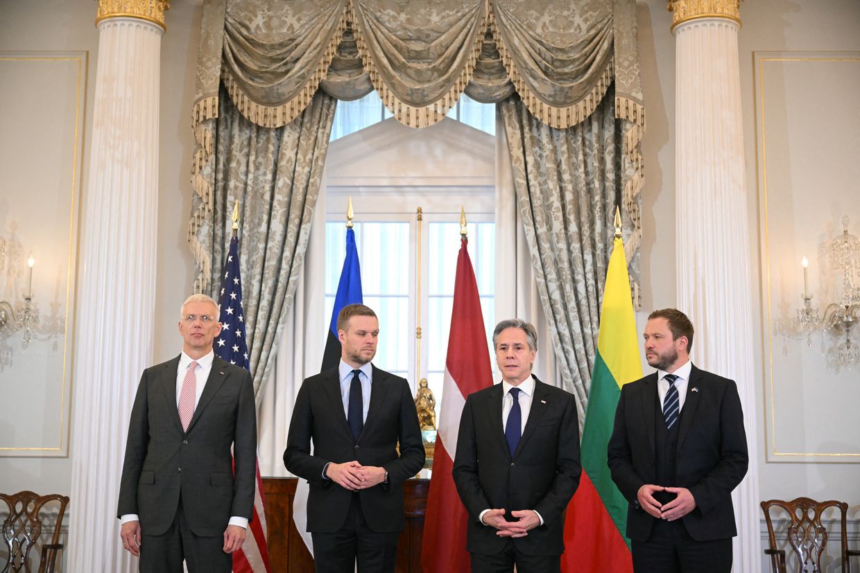 (L-R) Latvian Foreign Minister Krisjanis Karins, US Secretary Antony Blinken, and others meet at the State Department in D.C.