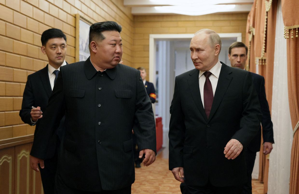 North Korea's leader Kim Jong Un (L) walks with Russian President Vladimir Putin shortly after Putin's arrival in Pyongyang, North Korea in 2024