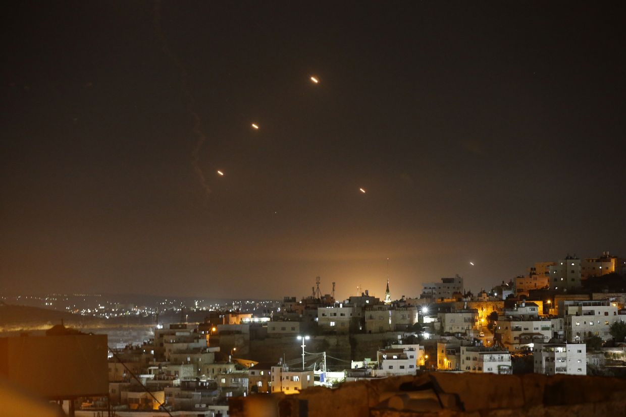 Many rockets fired from Iran are seen over Jerusalem from Hebron, West Bank, on Oct. 1, 2024. 