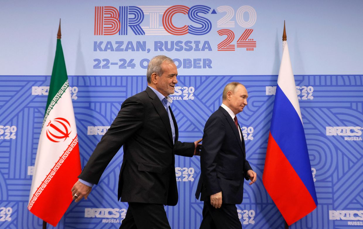 Russian President Vladimir Putin meets with Iranian President Masoud Pezeshkian on the sidelines of the BRICS summit in Kazan on Oct. 23, 2024.