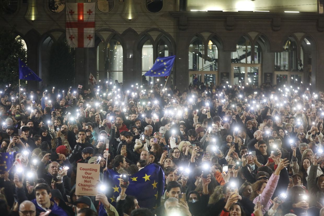 People attend an opposition rally against election results outside the parliament in Tbilisi, Georgia, on Oct. 28, 2024. 