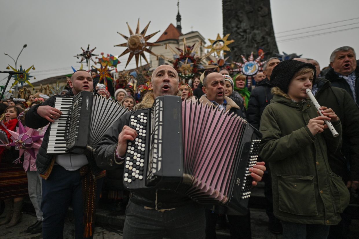 Participants perform carols during the Christmas Stars Festival at the Taras Shevchenko monument in Lviv, Ukraine, on Jan. 8, 2023.