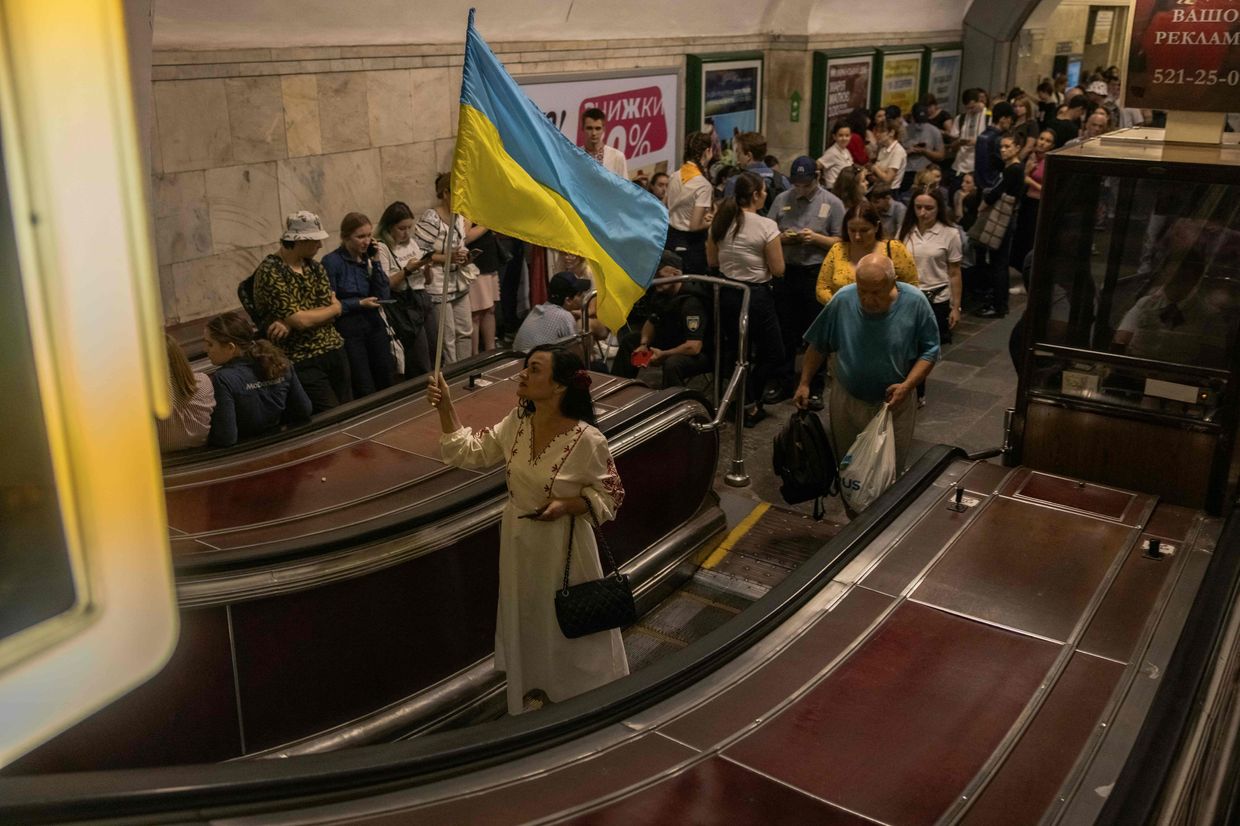 people shelter in Kyiv's Khreshchatyk metro during an air raid alarm on Independence Day, Aug. 24, 2023.