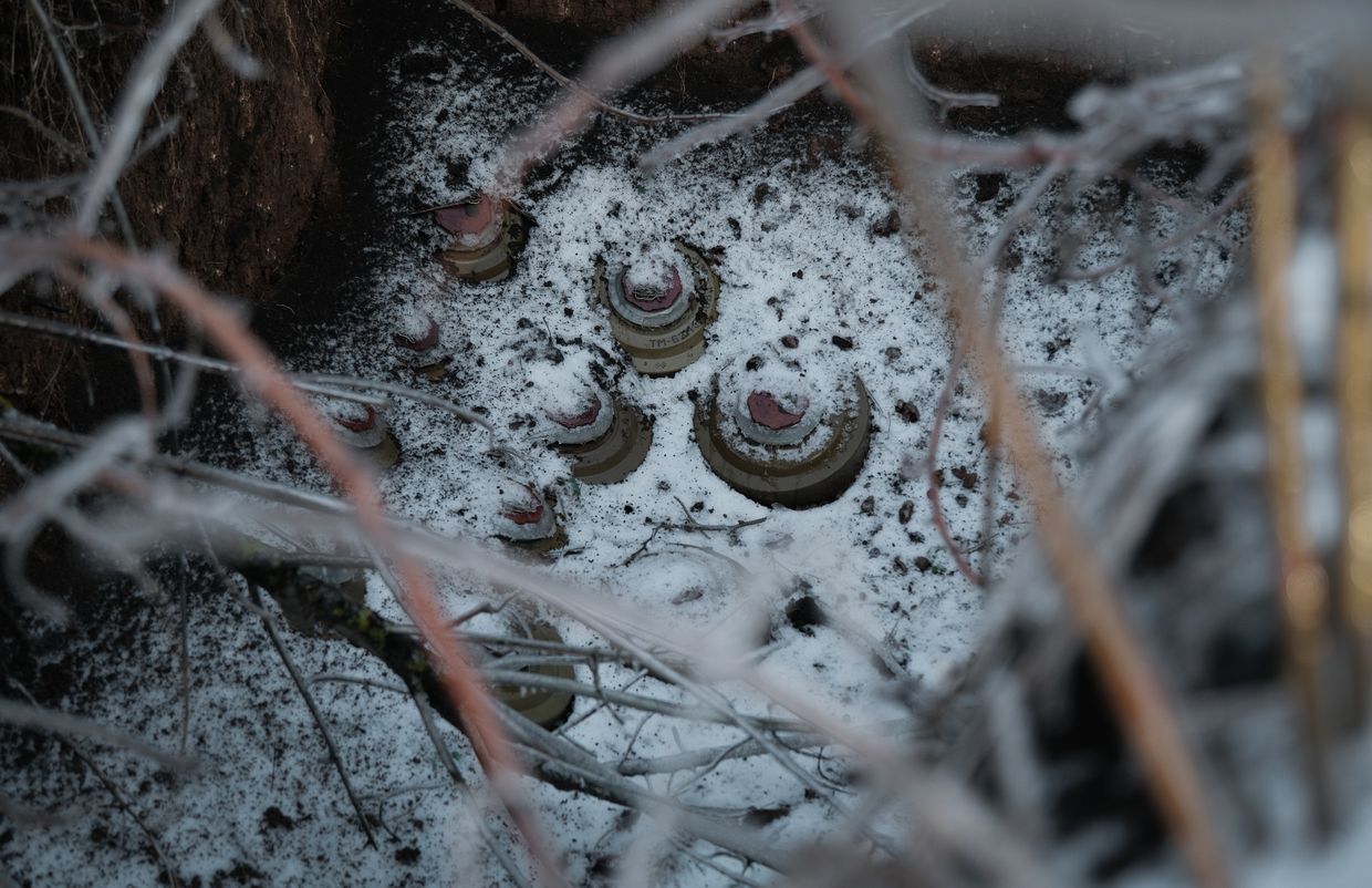 Snow-covered land mines lie in a trench at a Ukrainian military position near Horlivka, occupied since 2014, in Donetsk Oblast on Dec. 16, 2023.