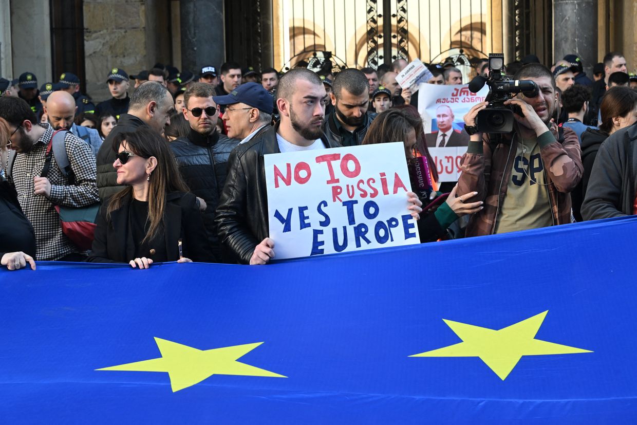 Georgian pro-democracy activists protest a repressive 'foreign influence' bill outside parliament in Tbilisi, Georgia, on April 15, 2024.