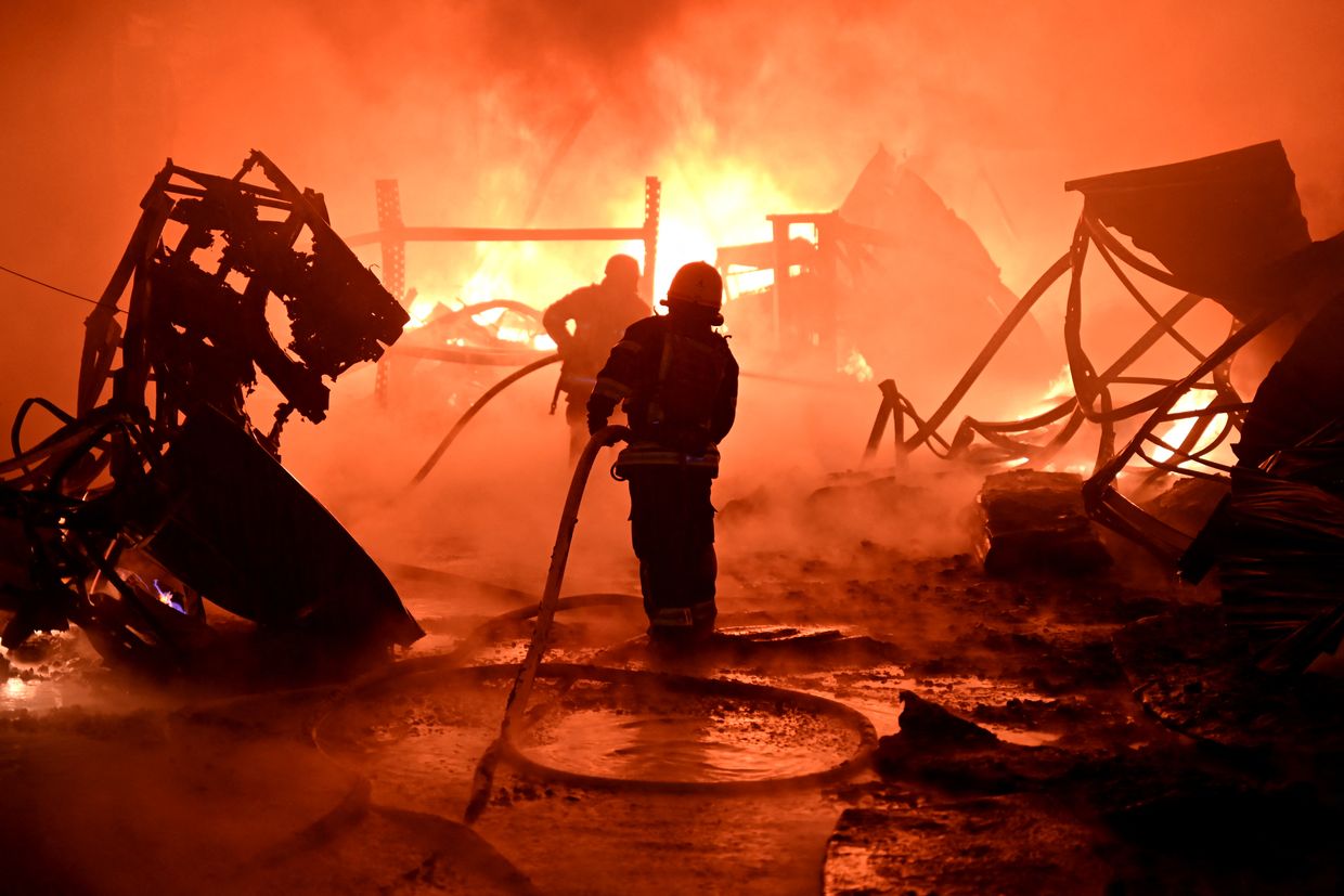 Ukrainian firefighters work to extinguish a fire at the site of a drone attack on industrial facilities in Kharkiv, Ukraine on May 4, 2024