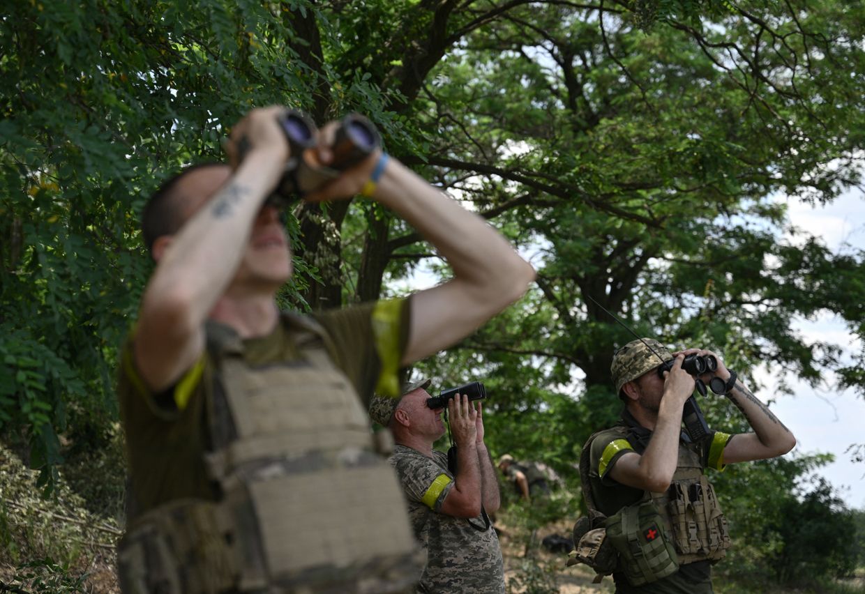 Ukrainian servicemen from the 24th Brigade scan the sky for Russian drones and aircraft in Donetsk Oblast, Ukraine, on June 11, 2024.