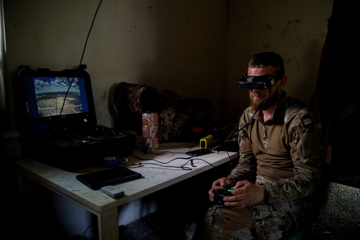  "'Kum,' commander of the special forces group, pilots a drone in Lyptsi, Kharkiv Oblast, Ukraine, on June 19, 2024.