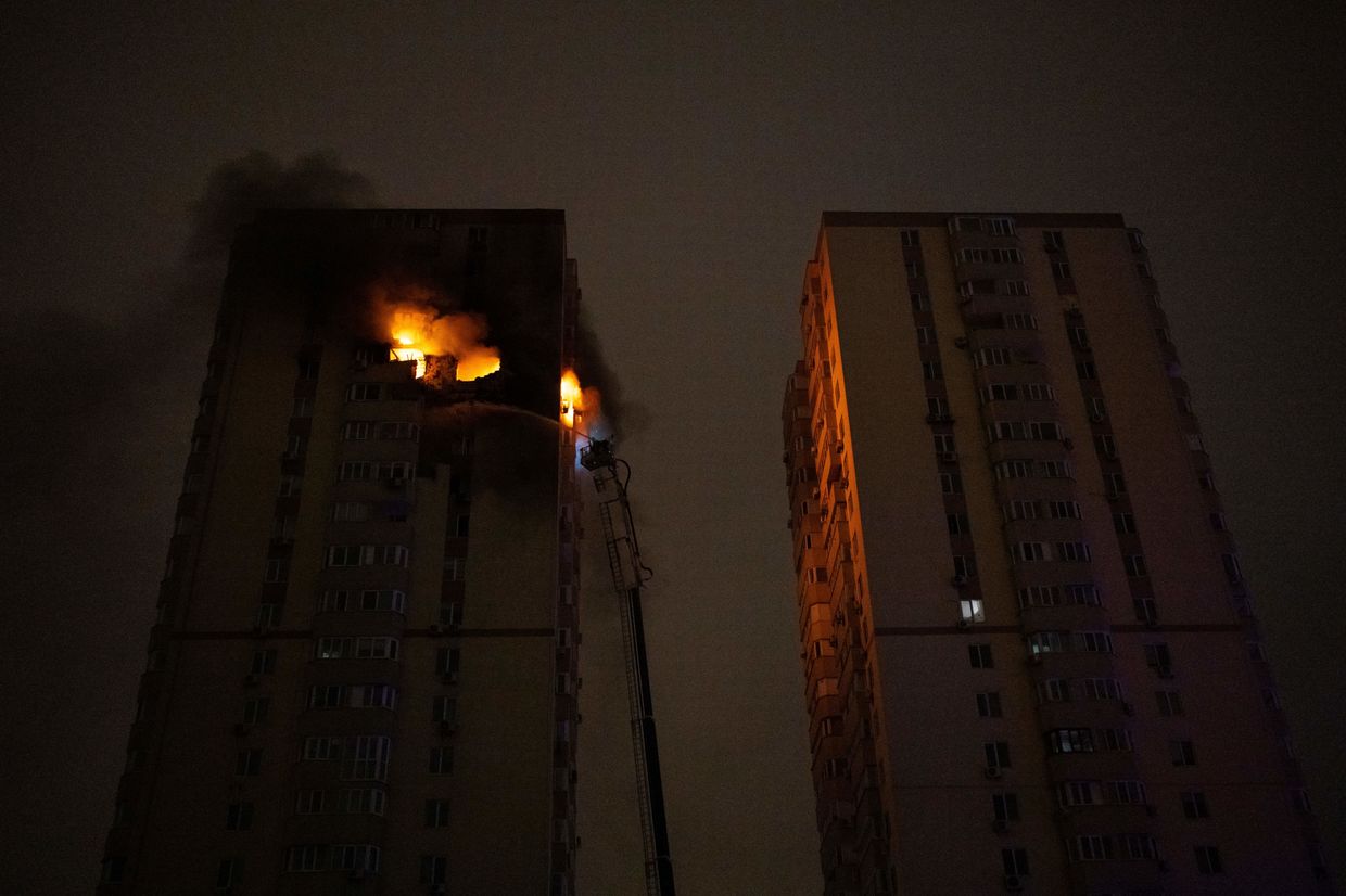 Ukrainian firefighters work to extinguish a fire in a high-rise reportedly hit by a drone in Kyiv, Ukraine, on Oct. 25, 2024.