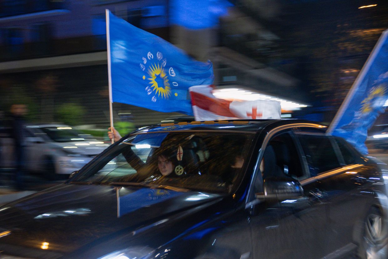 Georgian Dream Party supporters celebrate exit poll results outside new party headquarters on Georgian Election Day in Tbilisi, Georgia on Oct. 26, 2024.