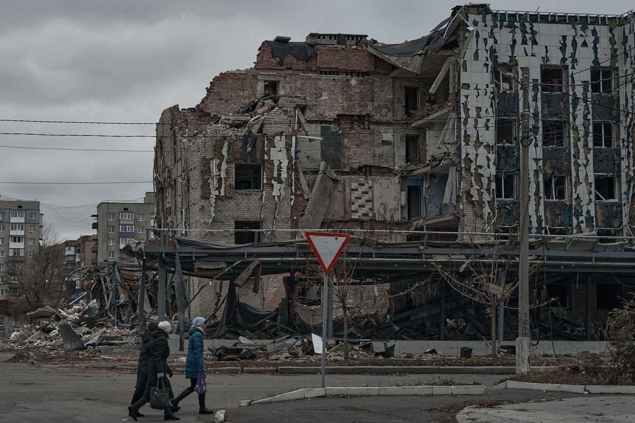 Residents walk past destroyed houses near the frontline in Pokrovsk, Ukraine, on Nov. 16, 2024.